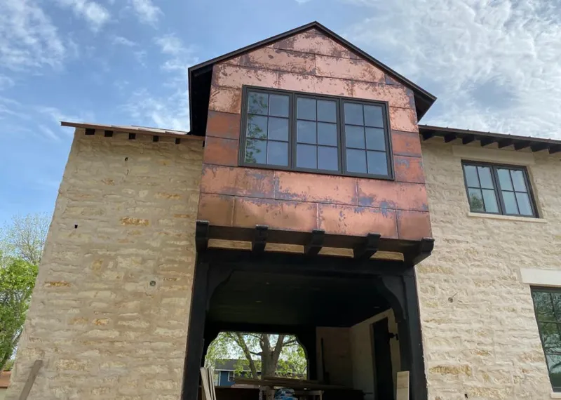 Copper metal panel facade on a stone building for Skylight Installation in South Pasadena