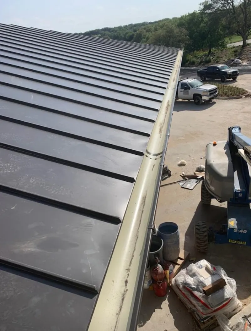 Standing seam panel and gutter detail on a metal roofing jobsite in South Pasadena